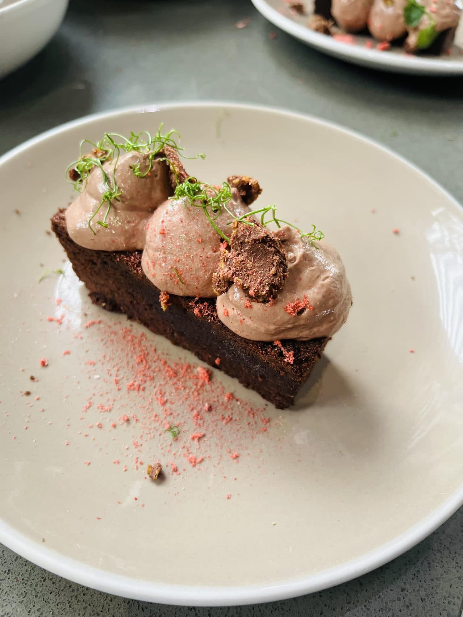 Chocolate brownie topped with piped chocolate mousse